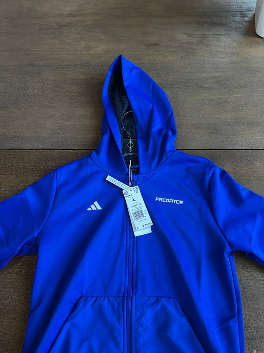 Blue hoodie with a brand tag on a wooden surface