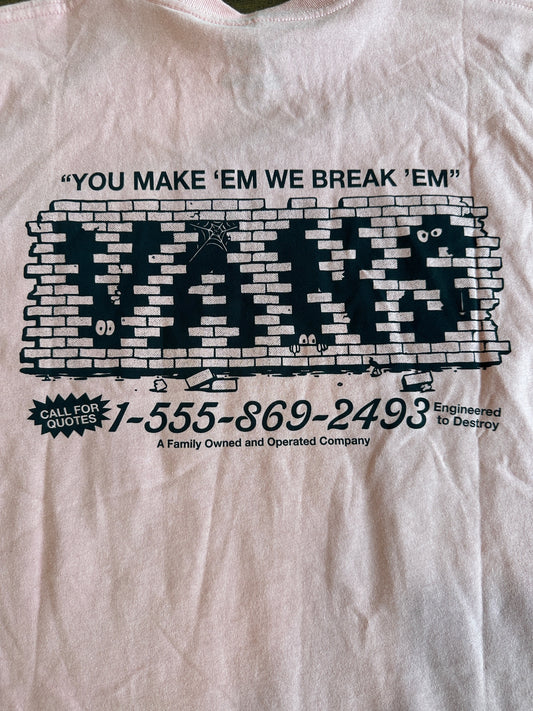 Pink t-shirt with black graphic design and text on a white background